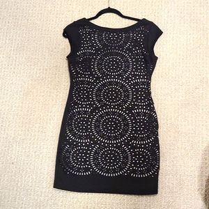 Black mini dress with lace-style cutouts